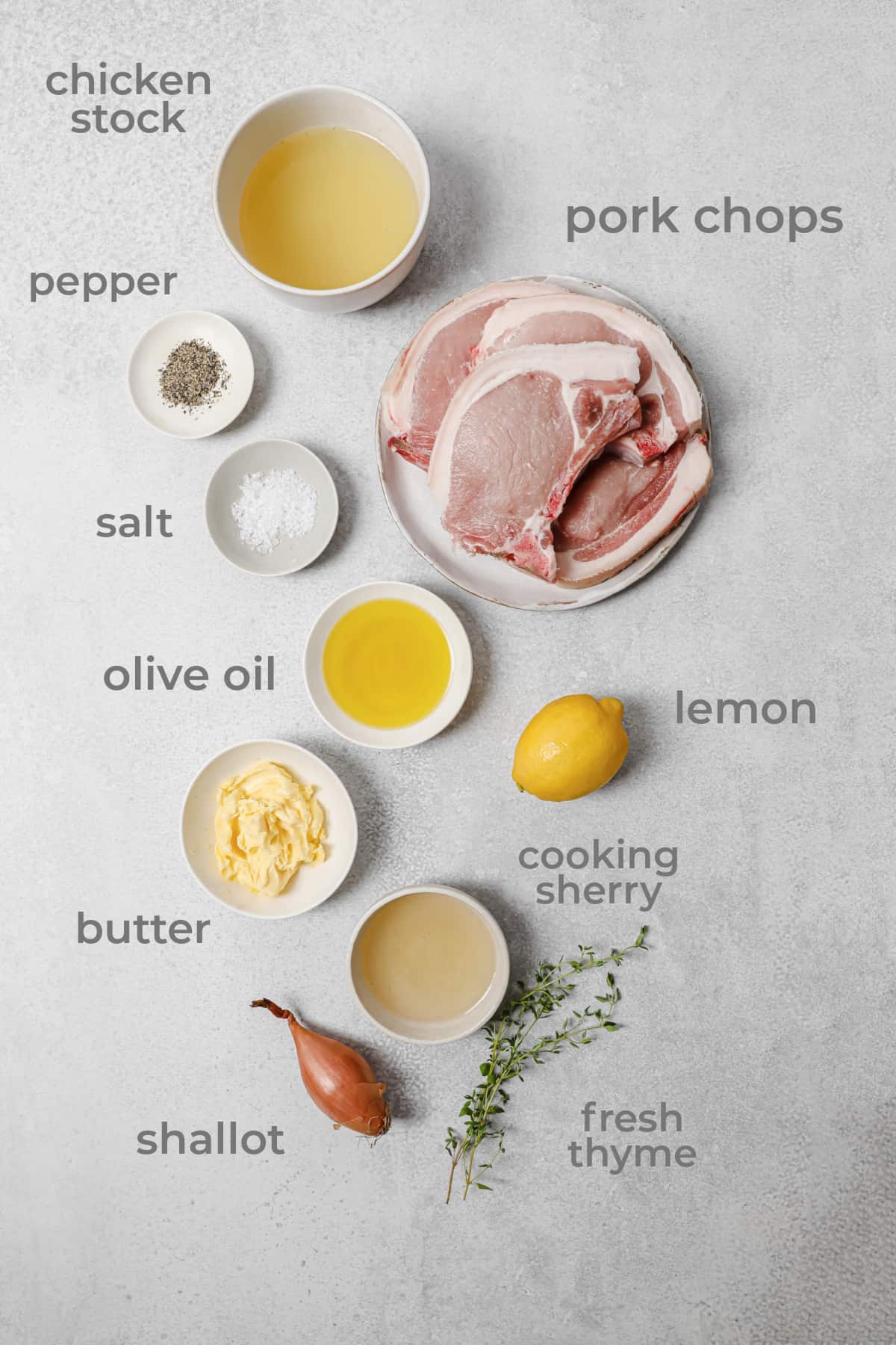 ingredients to make lemon thyme pork chops - pork, lemon, thyme, butter, chicken stock, shallot